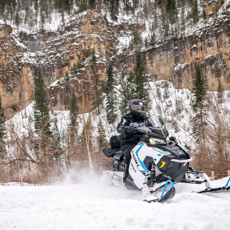 Black Hills Snowmobile Rider in Spearfish Canyon