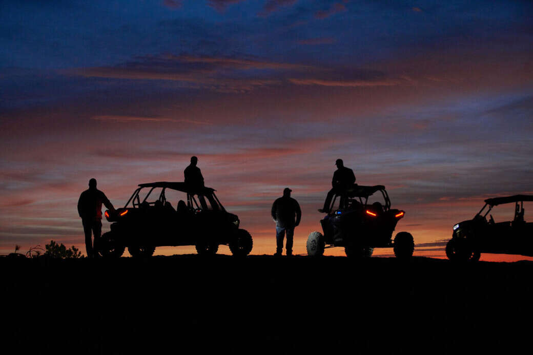 Polaris UTVs on Cement Ridge at sunrise