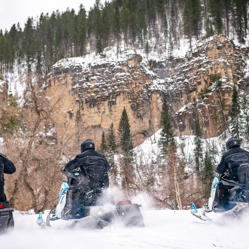 Snowmobiles riding on the Black Hills snowmobile Trails 