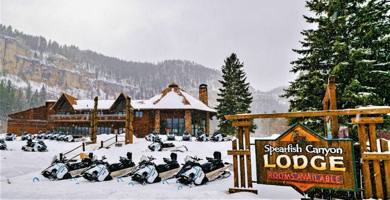 Polaris Snowmobiles in front of Spearfish Canyon Lodge