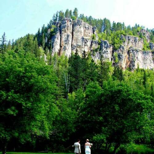 Bride & Groom with Spearfish Canyon's Limestone Cliffs in Background