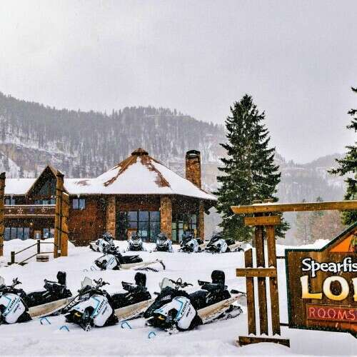 Polaris Snowmobiles in front of Spearfish Canyon Lodge