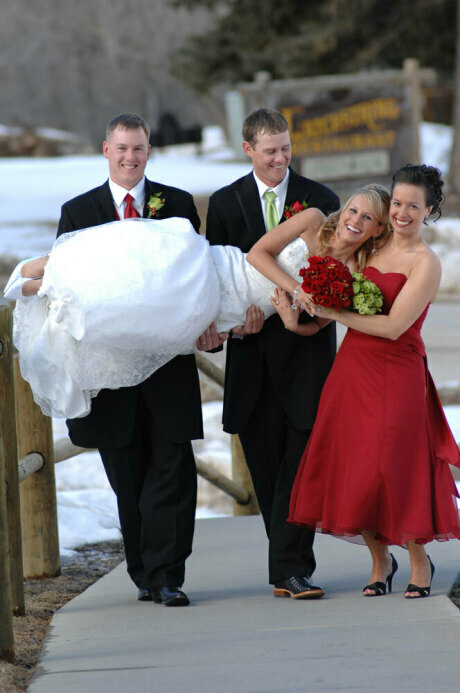 Winter Scene in Spearfish Canyon with Bride being carried by Groom and two members of Bridal Party