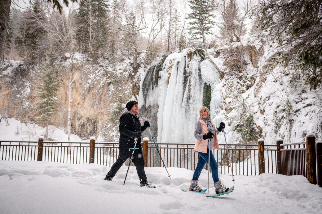 Couple snowshoeing at Spearfish Waterfall 