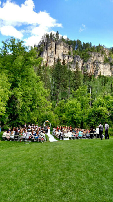 Spearfish Canyon Lodge Outdoor Wedding Ceremony with Limestone Cliffs in Background