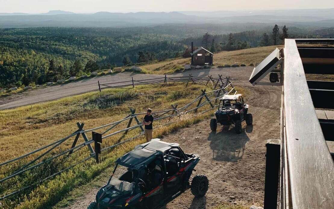 Polaris UTVs on Cement Ridge at sunrise
