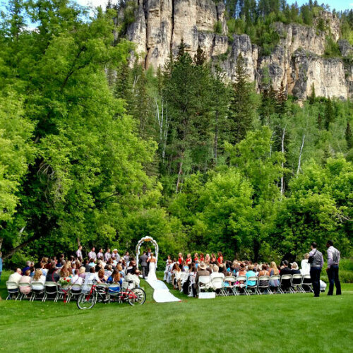 Spearfish Canyon Lodge Outdoor Wedding Ceremony with Limestone Cliffs in Background